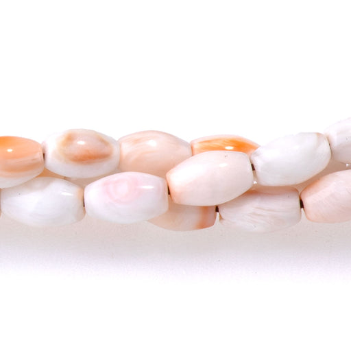 This is a Dakota Stones 4x6mm Lions Paw Light Orange Rice Gemstone strand of round beads in 15-16 inch strand.