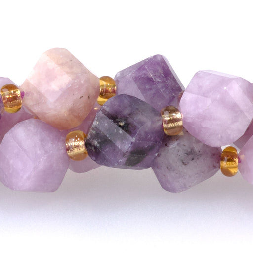 This is a Dakota Stones 7x8mm Lepidolite Swirl Gemstone strand with faceted oval beads in 15-16 inch strand.