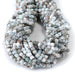 This is a Dakota Stones 4mm Larimar Matrix Gemstone strand with faceted cube beads in 15-16 inch strand.