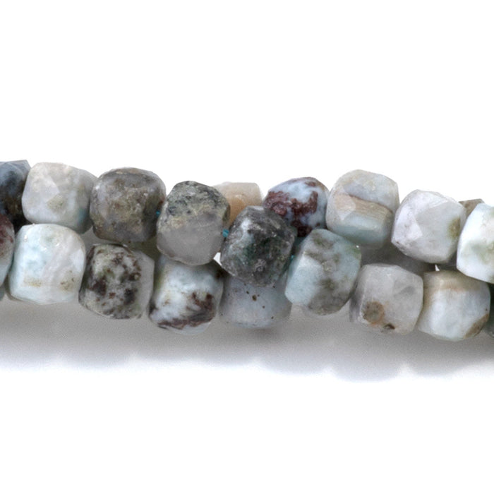 This is a Dakota Stones 4mm Larimar Matrix Gemstone strand with faceted cube beads in 15-16 inch strand.