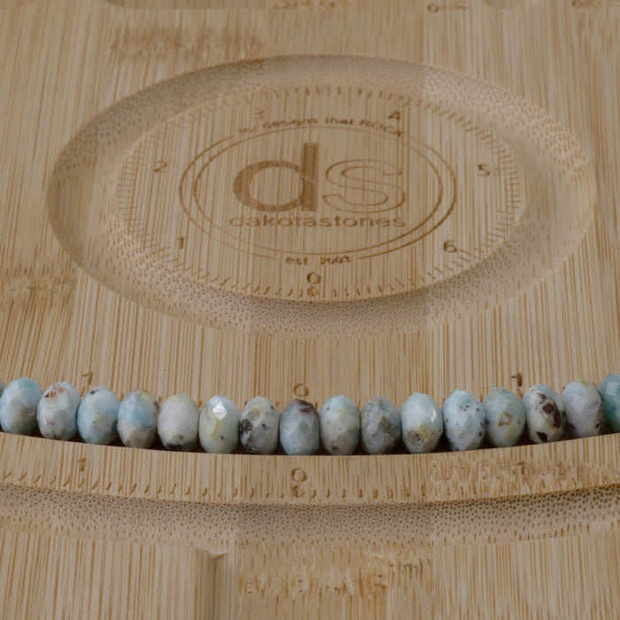 This is a Dakota Stones 5x8mm Larimar Gemstone strand with faceted rondelle beads in 15-16 inch strand.