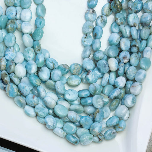 This is a Dakota Stones 8x10mm Larimar Puff Gemstone strand with A grade oval beads in 15-16 inch strand.