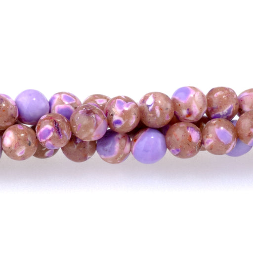 This is a Dakota Stones 4mm Magnesite Purple Gemstone strand with dyed round beads in 15-16 inch strand.