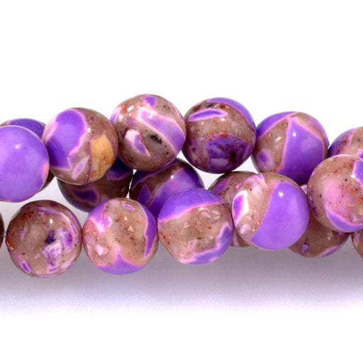 This is a Dakota Stones 6mm Magnesite Purple Gemstone strand with dyed round beads in 15-16 inch strand.