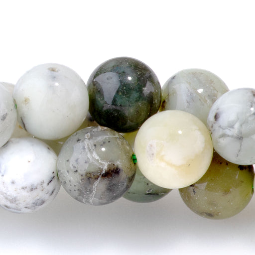 This is a Dakota Stones 8mm Madagascar Dendiritc Green Opal Gemstone strand with A grade round beads in 15-16 inch strand.