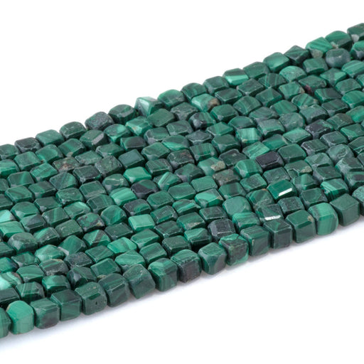 This is a Dakota Stones 4mm Malachite Gemstone strand with A grade table-cut cube beads in 15-16 inch strand.