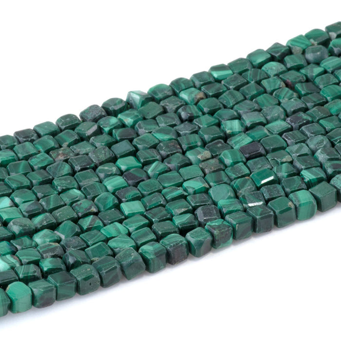 This is a Dakota Stones 4mm Malachite Gemstone strand with A grade table-cut cube beads in 15-16 inch strand.