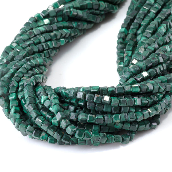 This is a Dakota Stones 4mm Malachite Gemstone strand with A grade table-cut cube beads in 15-16 inch strand.