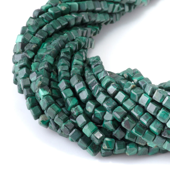 This is a Dakota Stones 4mm Malachite Gemstone strand with A grade table-cut cube beads in 15-16 inch strand.