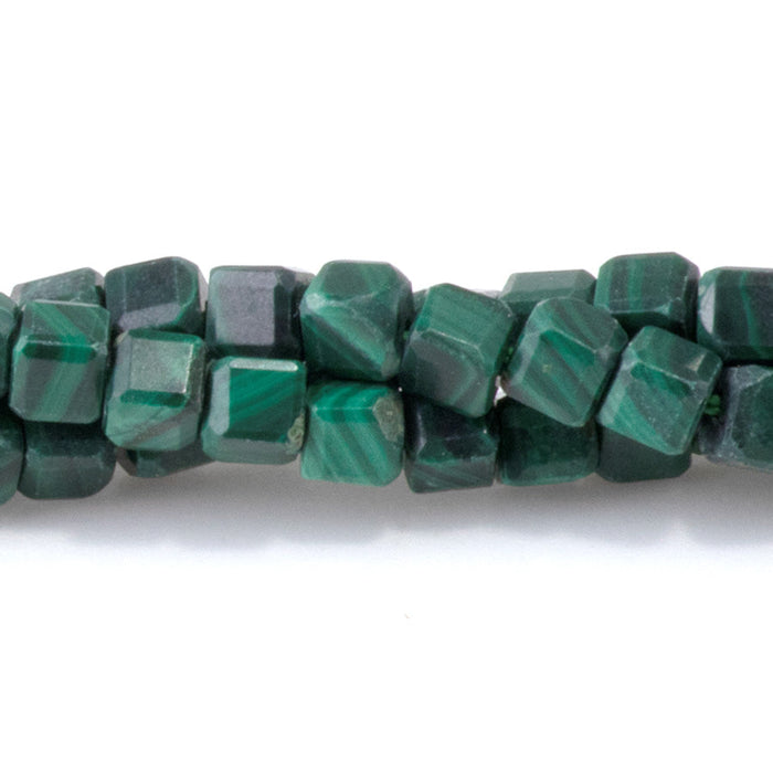 This is a Dakota Stones 4mm Malachite Gemstone strand with A grade table-cut cube beads in 15-16 inch strand.