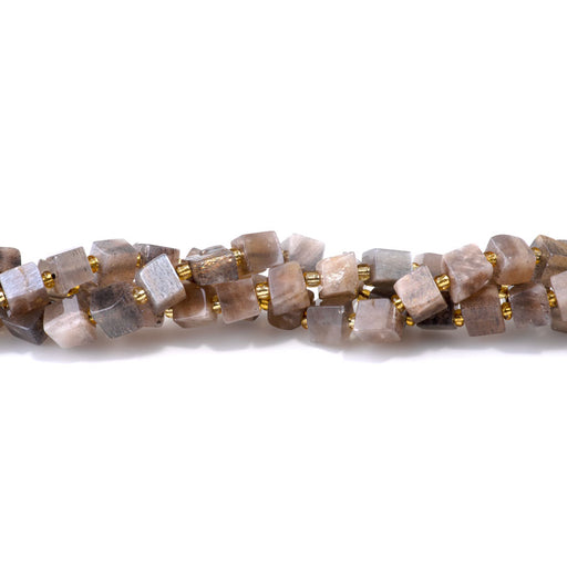 This is a Dakota Stones 6-8mm Black Moonstone Gemstone strand with irregular cube beads in 15-16 inch strand.