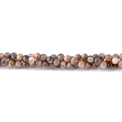 This is a Dakota Stones 6mm Moonstone Mixed Gemstone strand with round beads in 15-16 inch strand.