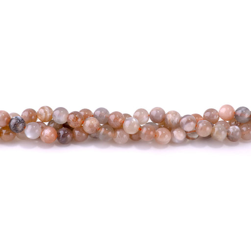 This is a Dakota Stones 6mm Silver Grey Mixed Moonstone Gemstone strand with round beads in 15-16 inch strand.