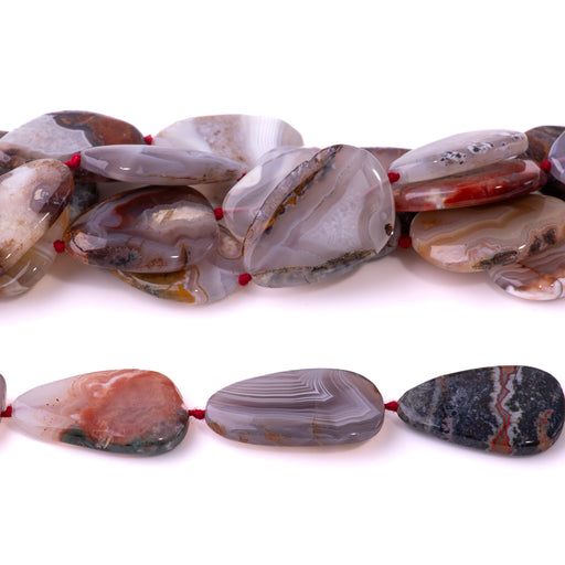 This is a Dakota Stones 25-35mm Morocco Agate Light Gemstone strand with free-form oval beads in 15-16 inch strand.