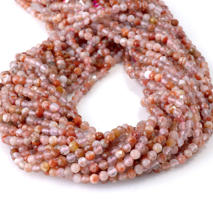 This is a Dakota Stones 4mm Morocco Red Agate Microfaceted Gemstone strand with round beads in 15-16 inch strand.
