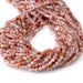 This is a Dakota Stones 4mm Morocco Red Agate Microfaceted Gemstone strand with round beads in 15-16 inch strand.