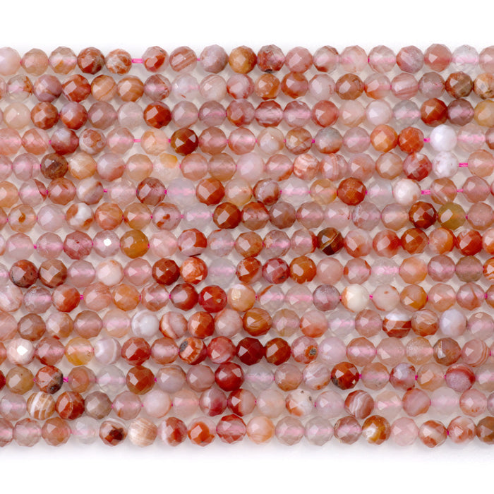 This is a Dakota Stones 4mm Morocco Red Agate Microfaceted Gemstone strand with round beads in 15-16 inch strand.