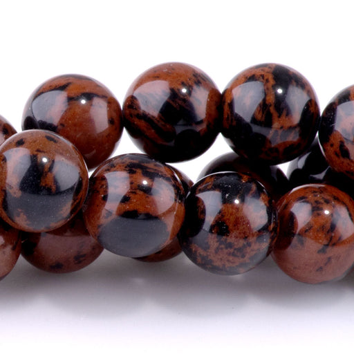 This is a Dakota Stones 10mm Mahogany Obsidian Gemstone strand with round beads in 15-16 inch strand.