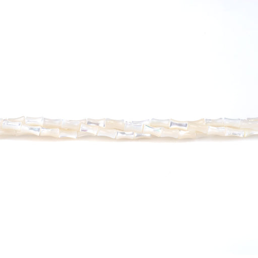 This is a Dakota Stones 4x7mm Mother of Pearl Bamboo White Gemstone strand of round beads in 15-16 inch strand.