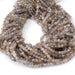This is a Dakota Stones 4mm Peach Black Moonstone Microfaceted Gemstone strand with round beads in 15-16 inch strand.