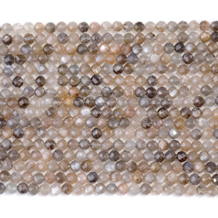 This is a Dakota Stones 4mm Peach Black Moonstone Microfaceted Gemstone strand with round beads in 15-16 inch strand.