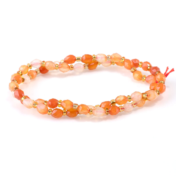 This is a Dakota Stones 4x6mm Agate Triangle Cut Rice Gemstone strand with natural faceted beads in 15-16 inch strand.