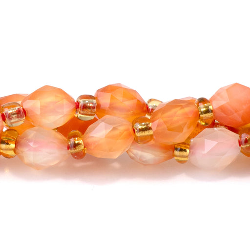 This is a Dakota Stones 4x6mm Agate Triangle Cut Rice Gemstone strand with natural faceted beads in 15-16 inch strand.