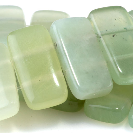 This is a Dakota Stones 10x20mm New Jade Double Drill Gemstone strand of round beads in 8 inch strand.