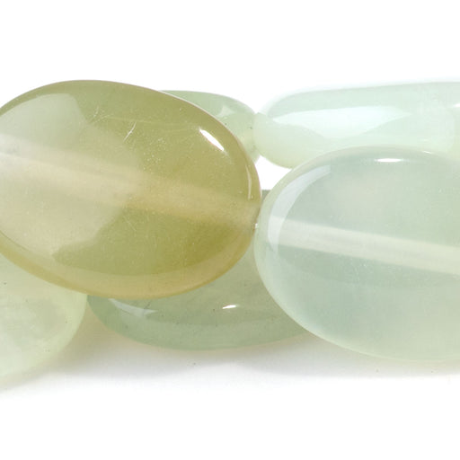 This is a Dakota Stones 13x18mm New Jade Gemstone strand with oval beads in 8 inch strand.