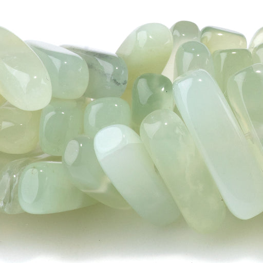 This is a Dakota Stones 5x15mm New Jade Gemstone strand with chip beads in 8 inch strand.