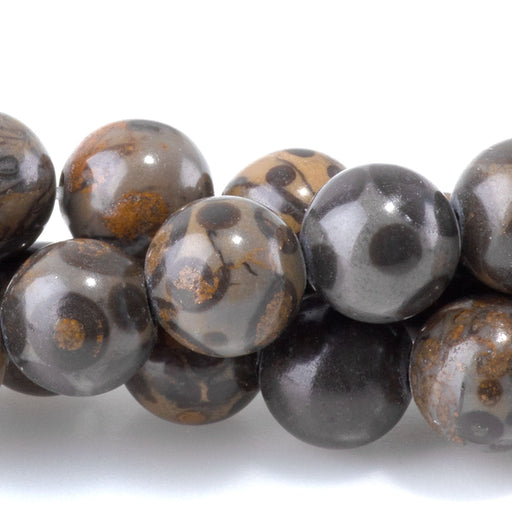 This is a Dakota Stones 8mm Orbicular Rhyolite Gemstone strand with round beads in 15-16 inch strand.