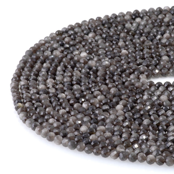This is a Dakota Stones 4mm Silver Obsidian Microfaceted Gemstone strand with round beads in 15-16 inch strand.