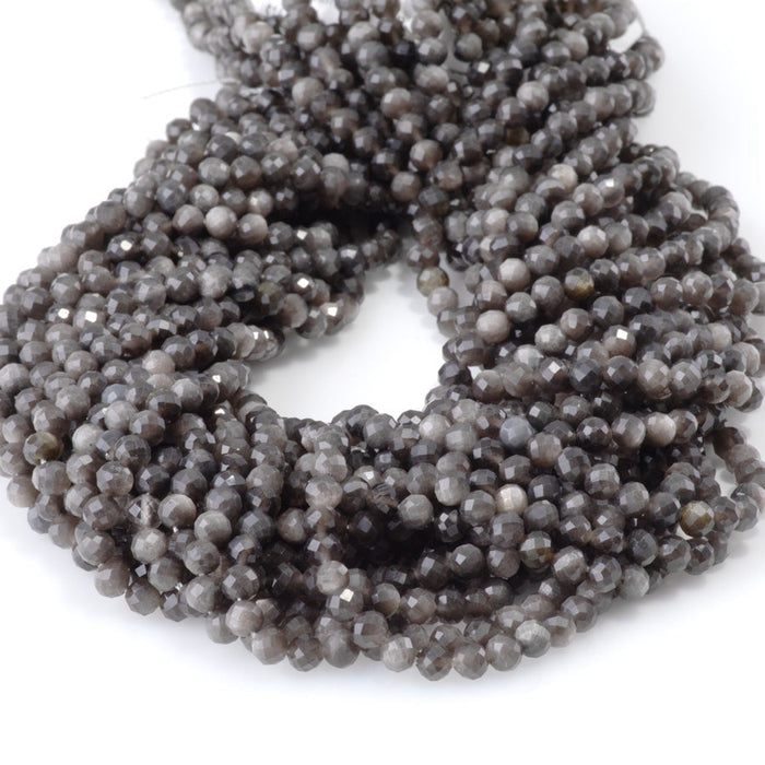 This is a Dakota Stones 4mm Silver Obsidian Microfaceted Gemstone strand with round beads in 15-16 inch strand.