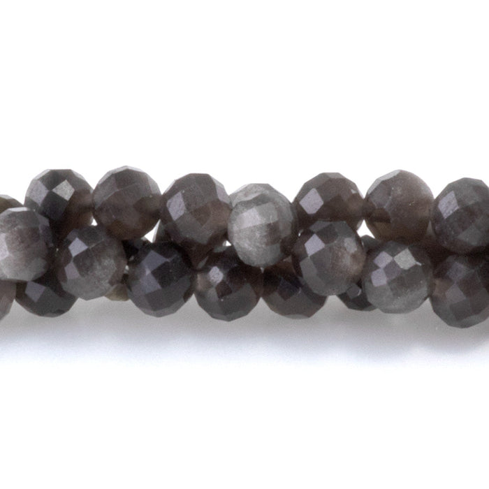This is a Dakota Stones 4mm Silver Obsidian Microfaceted Gemstone strand with round beads in 15-16 inch strand.