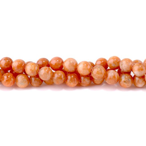 This is a Dakota Stones 10mm Orange Calcite Gemstone strand with AAA grade round beads in 15-16 inch strand.