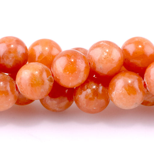 This is a Dakota Stones 8mm Orange Calcite Gemstone strand with AAA grade round beads in 15-16 inch strand.
