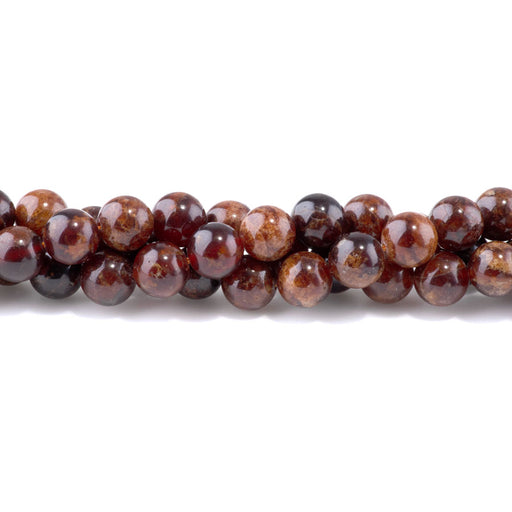 This is a Dakota Stones 10mm Orange Garnet Gemstone strand with round beads in 8 inch strand.