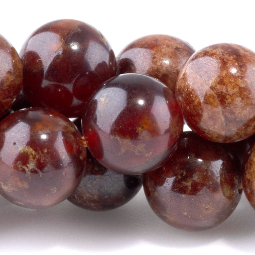 This is a Dakota Stones 10mm Orange Garnet Gemstone strand with round beads in 8 inch strand.