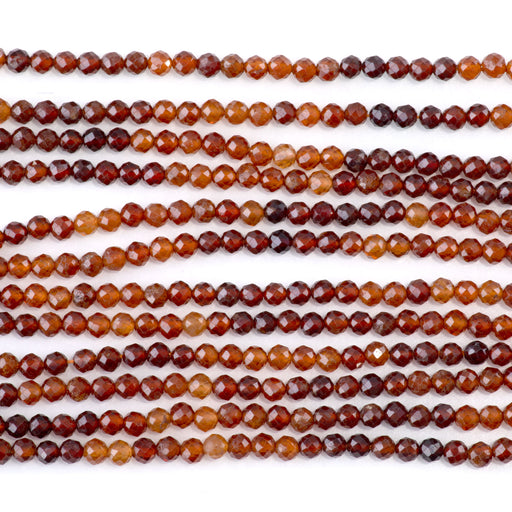 This is a Dakota Stones 3mm Orange Garnet Banded Gemstone strand with faceted round beads in 15-16 inch strand.