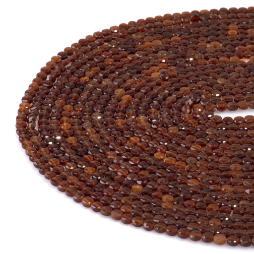 This is a Dakota Stones 4mm Orange Garnet Gemstone strand with faceted coin beads in 15-16 inch strand.