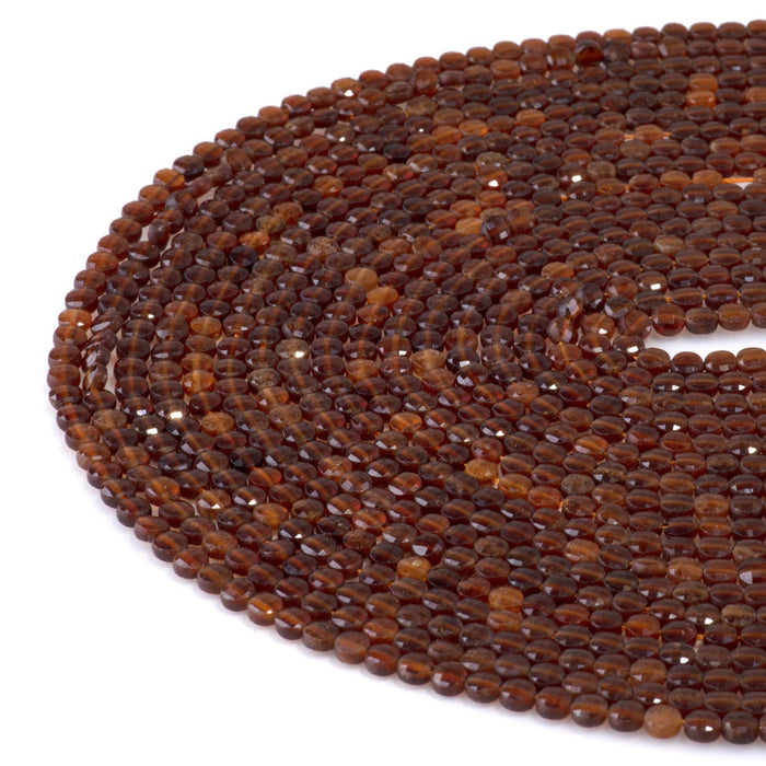 This is a Dakota Stones 4mm Orange Garnet Gemstone strand with faceted coin beads in 15-16 inch strand.