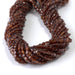 This is a Dakota Stones 4mm Orange Garnet Gemstone strand with faceted coin beads in 15-16 inch strand.