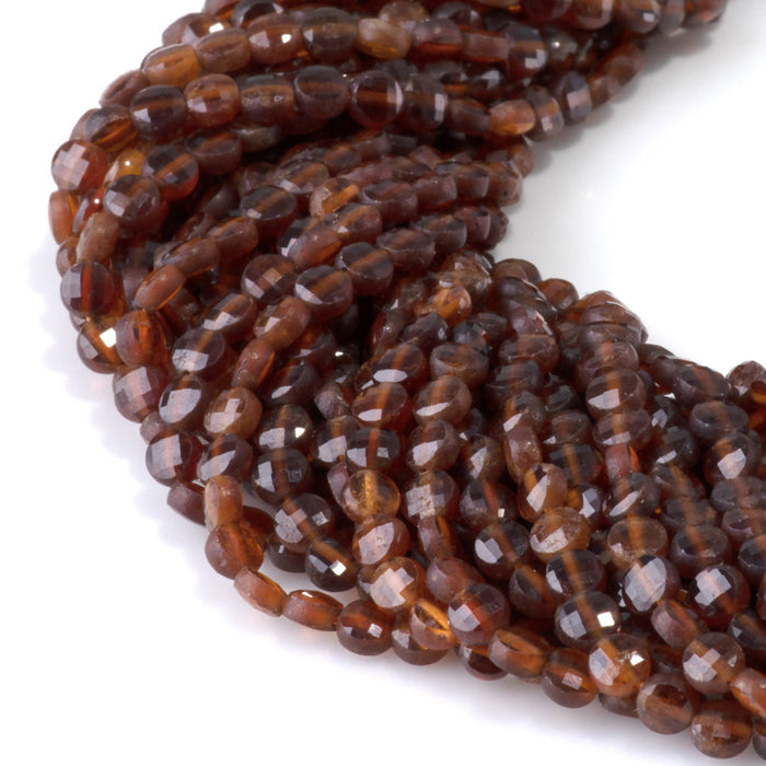 This is a Dakota Stones 4mm Orange Garnet Gemstone strand with faceted coin beads in 15-16 inch strand.