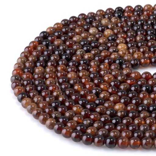 This is a Dakota Stones 6mm Orange Garnet Gemstone strand with round beads in 15-16 inch strand.