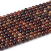 This is a Dakota Stones 6mm Orange Garnet Gemstone strand with round beads in 15-16 inch strand.