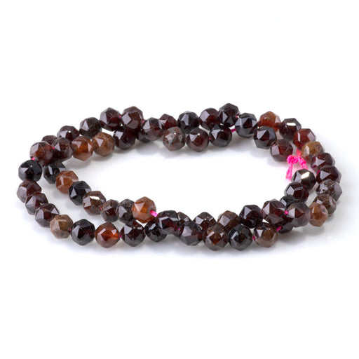 This is a Dakota Stones 6mm Orange Garnet Gemstone strand with double heart faceted round beads in 15-16 inch strand.