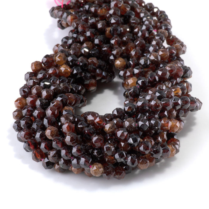 This is a Dakota Stones 6mm Orange Garnet Gemstone strand with double heart faceted round beads in 15-16 inch strand.