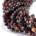 This is a Dakota Stones 6mm Orange Garnet Gemstone strand with double heart faceted round beads in 15-16 inch strand.