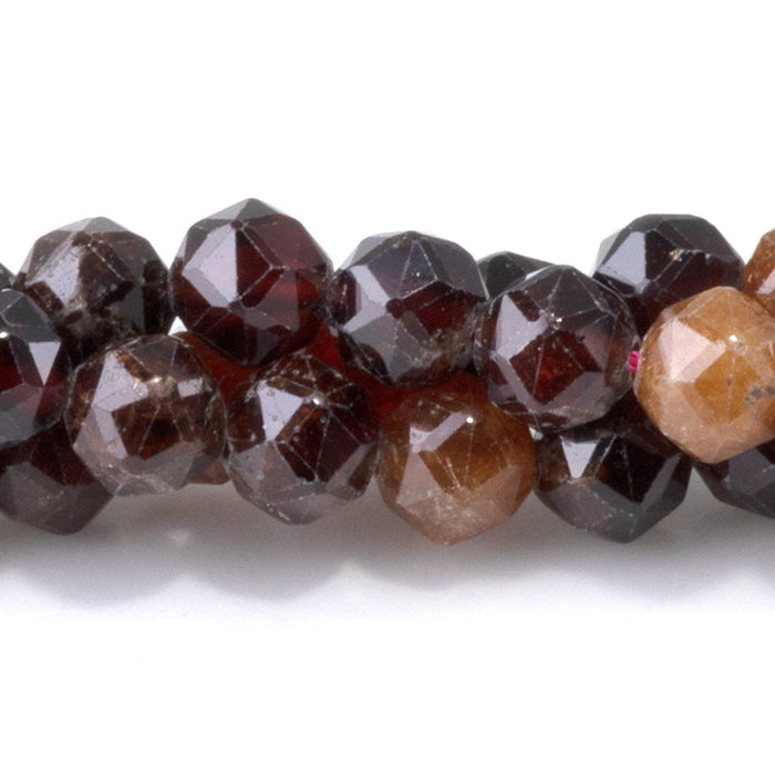 This is a Dakota Stones 6mm Orange Garnet Gemstone strand with double heart faceted round beads in 15-16 inch strand.