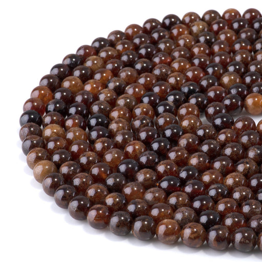 This is a Dakota Stones 8mm Orange Garnet Gemstone strand with round beads in 15-16 inch strand.